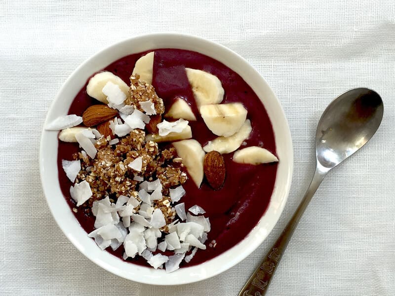 Acai bowl with coconut, banana and almonds.