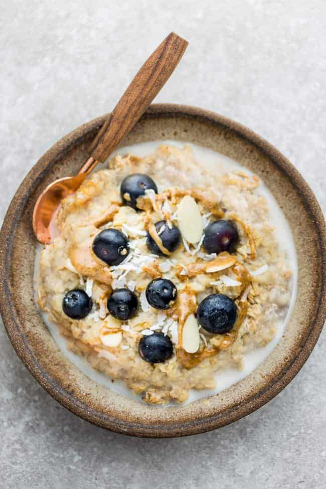 A bowl of blueberry overnight oats with almond. 