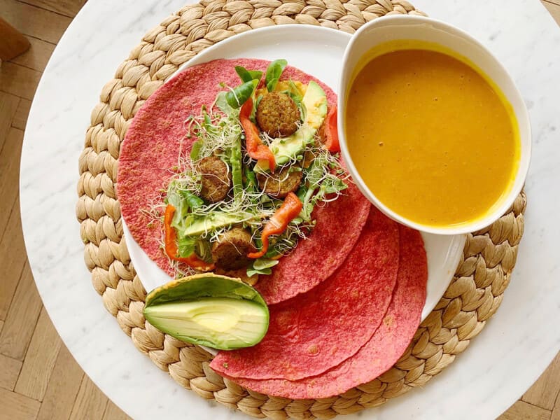 Pumkinsoup served with vegetable wraps with falafel, bell pepper and avocado. 